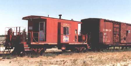 The caboose and the box car share the site