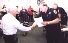 Your webmaster receiving congratulation from Chief James H. Jenkins
