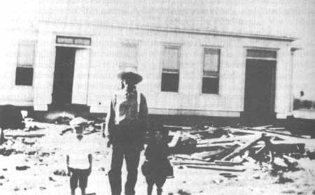 Judge Moore in front of new building