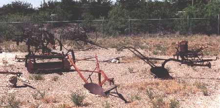 Farming equipment behind the Holman House